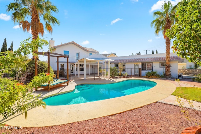 view of swimming pool featuring a pergola and a patio area