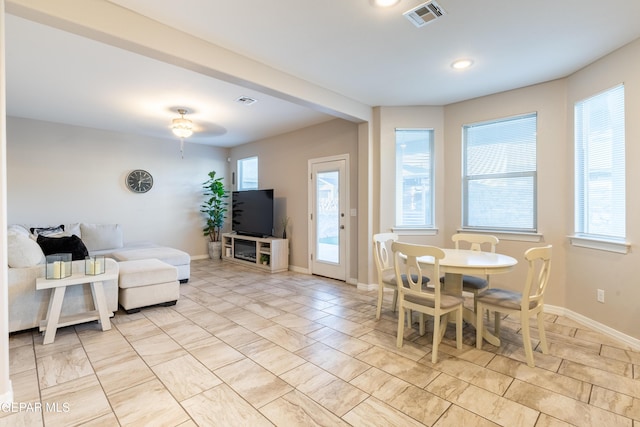 dining space with ceiling fan and a healthy amount of sunlight