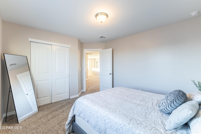 bedroom featuring carpet and a closet