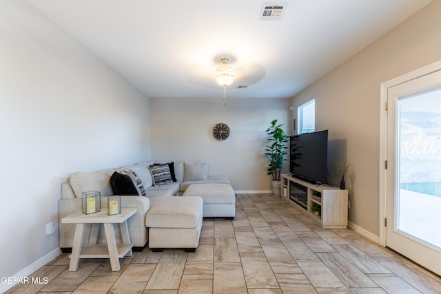 living room featuring ceiling fan