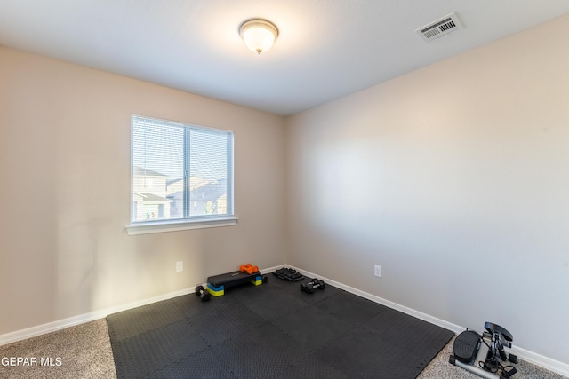 workout room featuring carpet