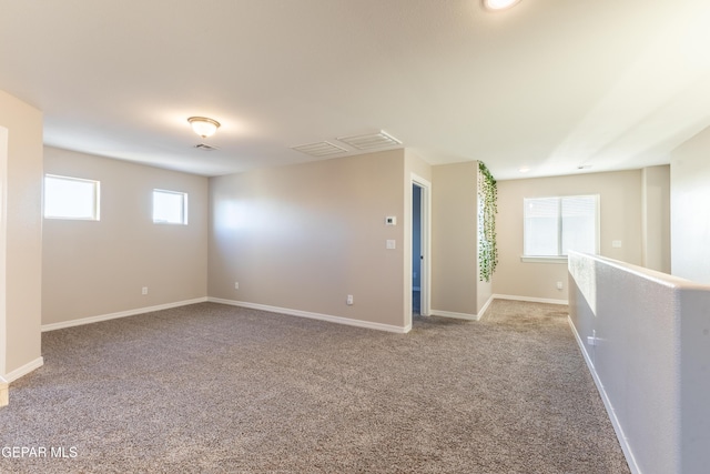 unfurnished room with light carpet