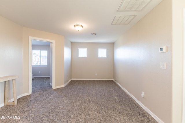 spare room featuring carpet floors