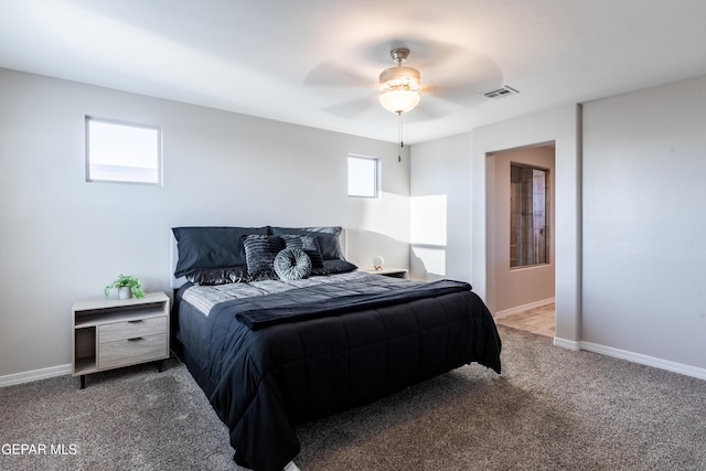 bedroom featuring ceiling fan and carpet