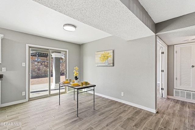 office area featuring a textured ceiling