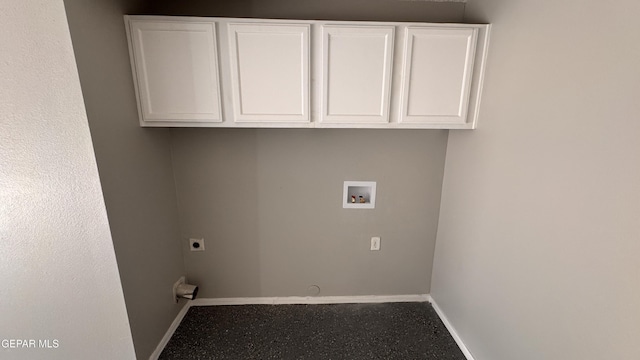 washroom with cabinets, hookup for an electric dryer, and hookup for a washing machine