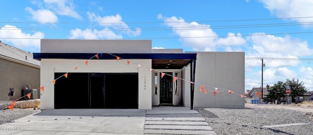 view of front of home featuring cooling unit