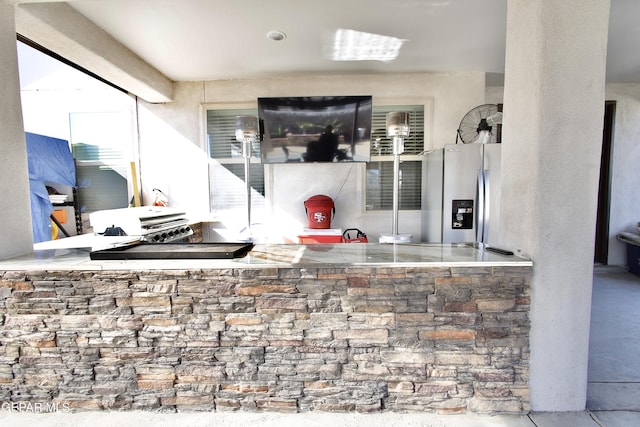 kitchen featuring stainless steel fridge