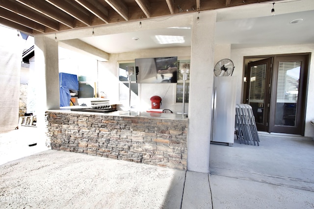 view of patio featuring a bar