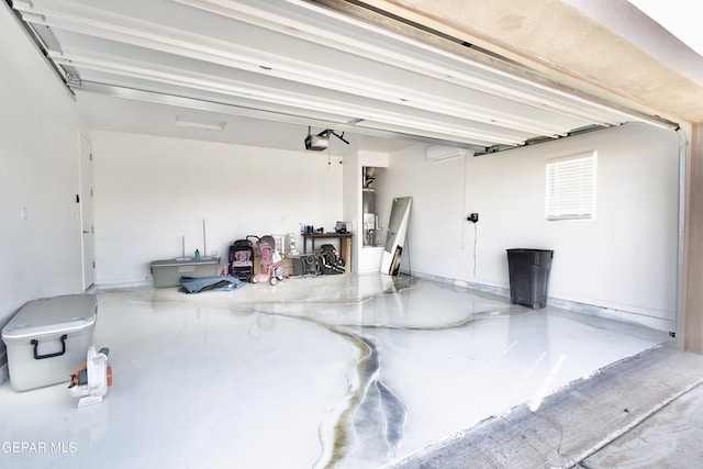 garage with water heater and a garage door opener