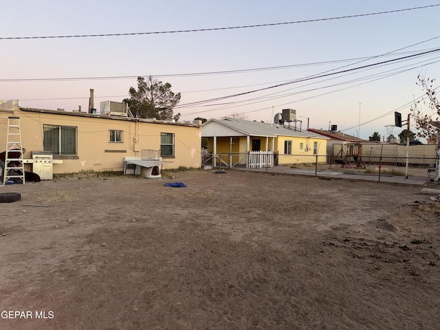 view of front of house featuring cooling unit