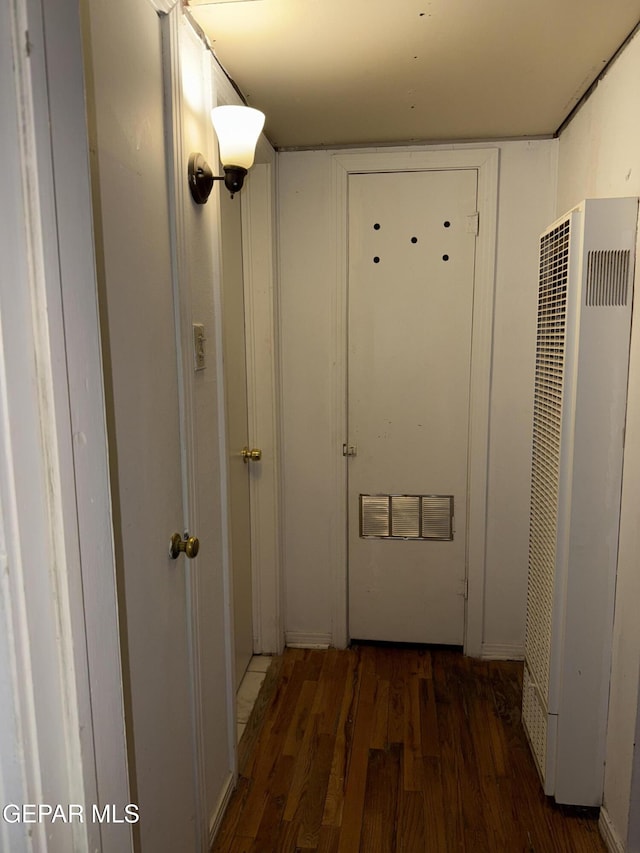 hallway featuring dark hardwood / wood-style flooring