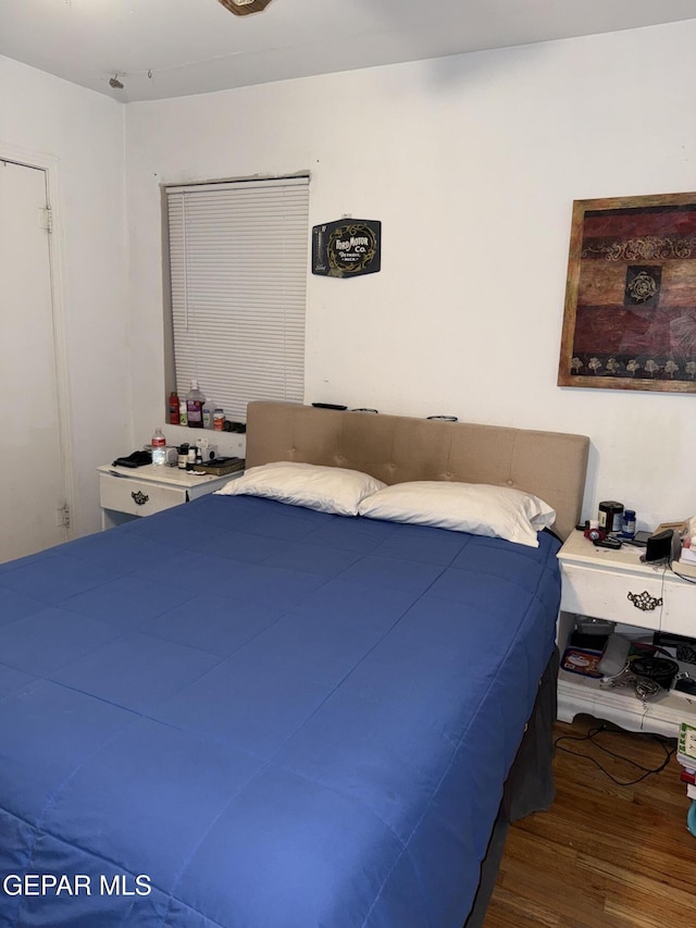 bedroom featuring wood-type flooring