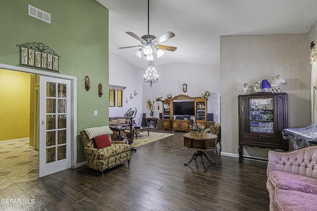 living room with vaulted ceiling, dark wood-type flooring, french doors, and ceiling fan