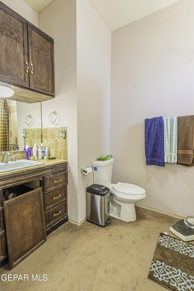 bathroom with toilet and vanity