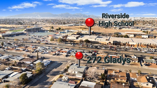 birds eye view of property featuring a mountain view