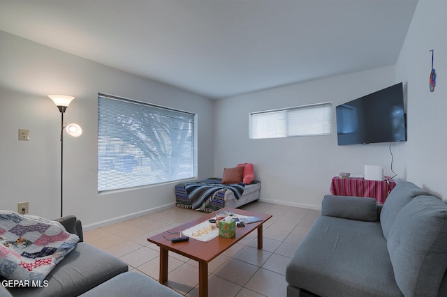 living room featuring light tile patterned floors and a wealth of natural light