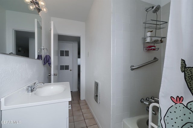 bathroom with tile patterned flooring, heating unit, shower / bathtub combination with curtain, and vanity