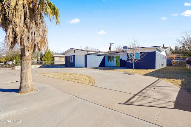 ranch-style house featuring a garage