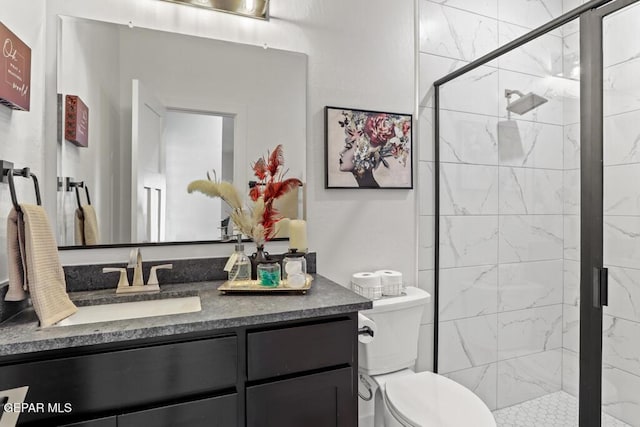 bathroom with vanity, toilet, and an enclosed shower