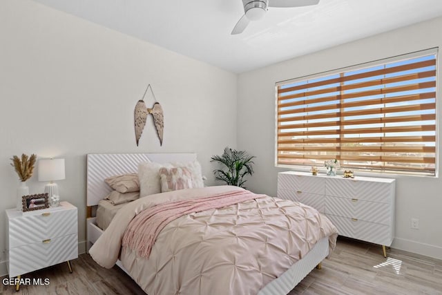 bedroom featuring ceiling fan and wood-type flooring
