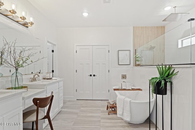 bathroom with vanity and separate shower and tub