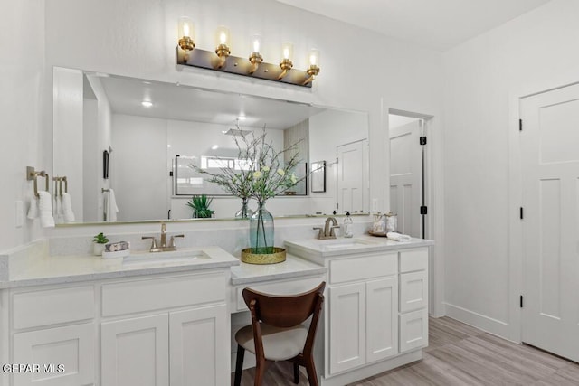 bathroom featuring wood-type flooring and vanity