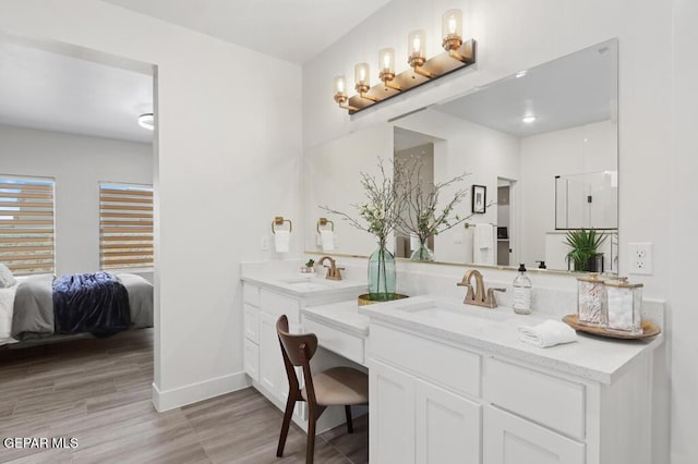 bathroom with vanity and wood-type flooring