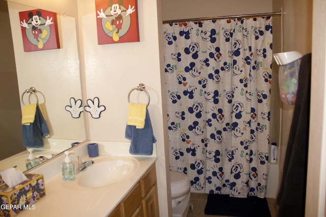 bathroom with vanity, tile patterned flooring, toilet, and a shower with shower curtain