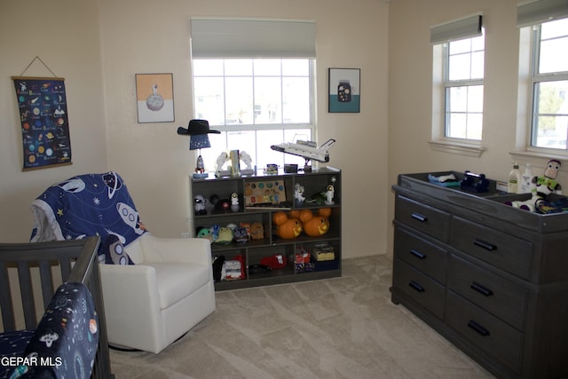 carpeted bedroom featuring multiple windows