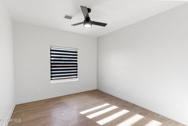 spare room with ceiling fan and light hardwood / wood-style flooring