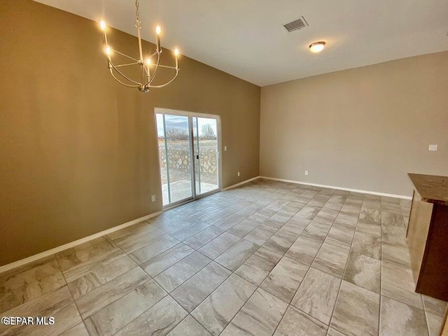 unfurnished dining area featuring a notable chandelier