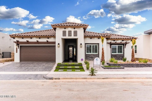 mediterranean / spanish-style house featuring a garage