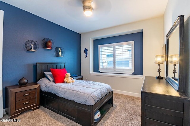 carpeted bedroom with ceiling fan