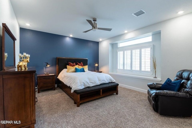 bedroom featuring ceiling fan and carpet