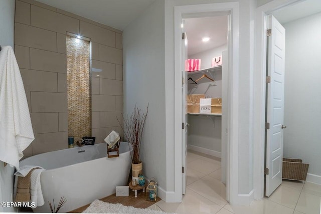 bathroom featuring tile patterned floors and a washtub