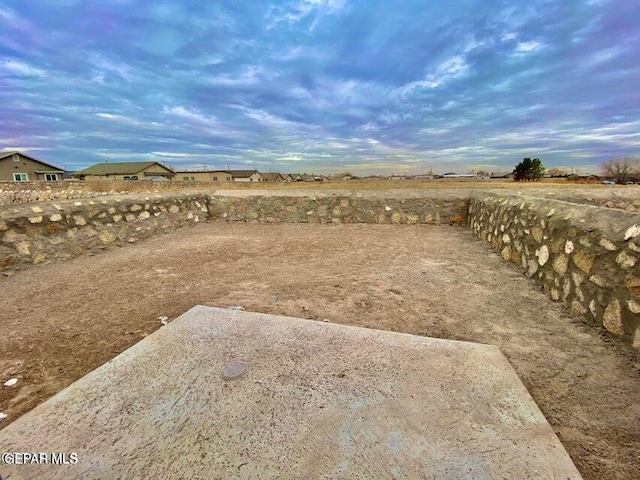 view of yard with a rural view