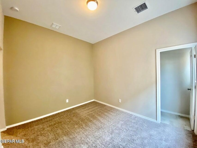 unfurnished room featuring carpet