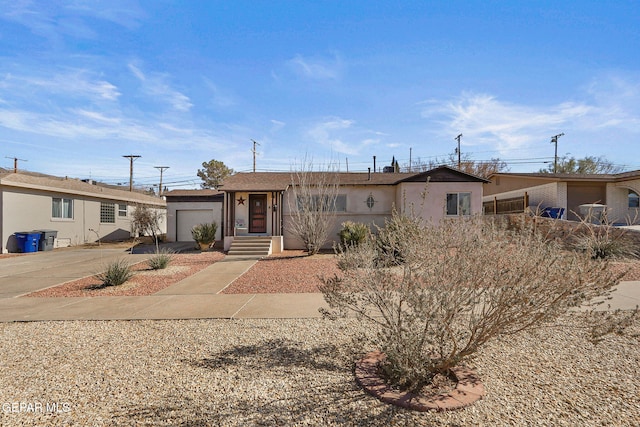 ranch-style house featuring a garage