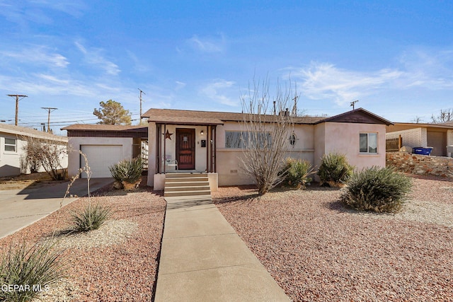 ranch-style home featuring a garage