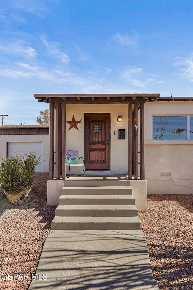 entrance to property featuring a garage