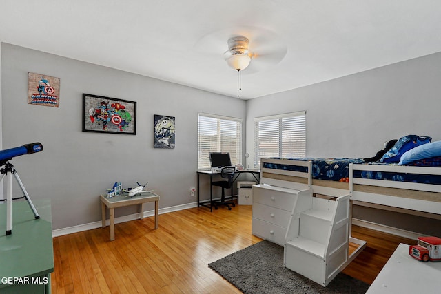 bedroom with ceiling fan and hardwood / wood-style floors