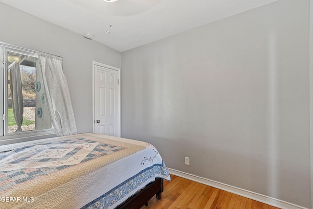 bedroom featuring ceiling fan and wood-type flooring