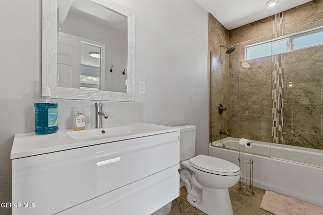 full bathroom with tile patterned flooring, shower / bath combination with glass door, vanity, and toilet