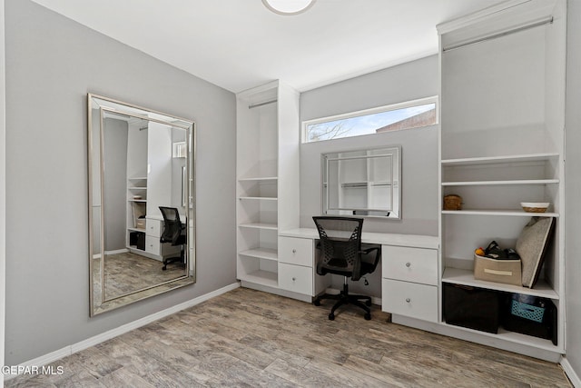 unfurnished office with light hardwood / wood-style floors