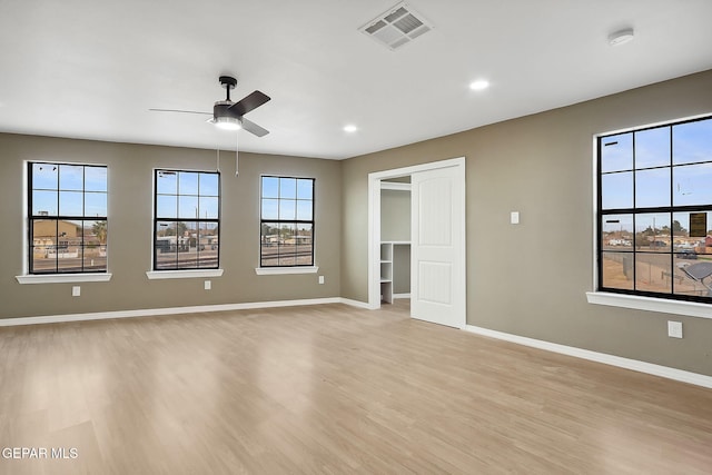 interior space with light wood-type flooring and ceiling fan