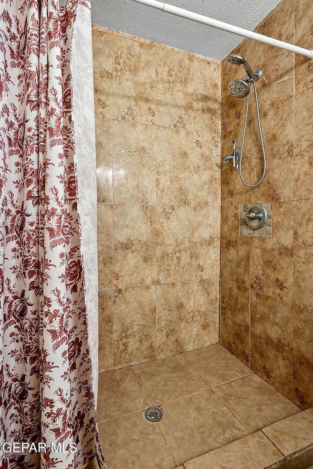 bathroom with curtained shower