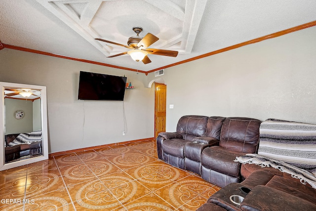 tiled living room with a textured ceiling, ceiling fan, and ornamental molding