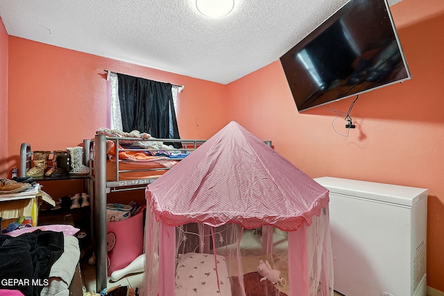 miscellaneous room featuring a textured ceiling