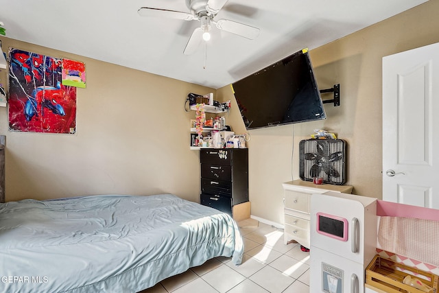 tiled bedroom featuring ceiling fan